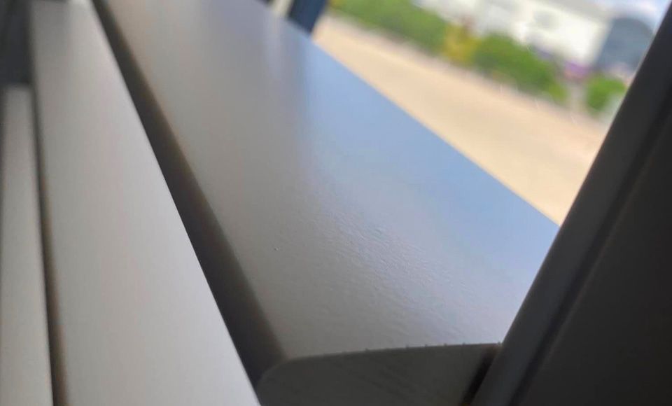 close-up of hardwood shutter on window